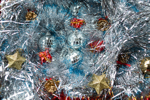 Christmas toys on the silver tinsel