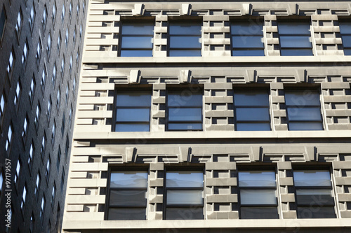 part of two facades of high rise buildings in new york city with