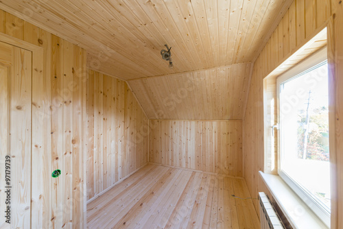 Room upholstered with clapboard.