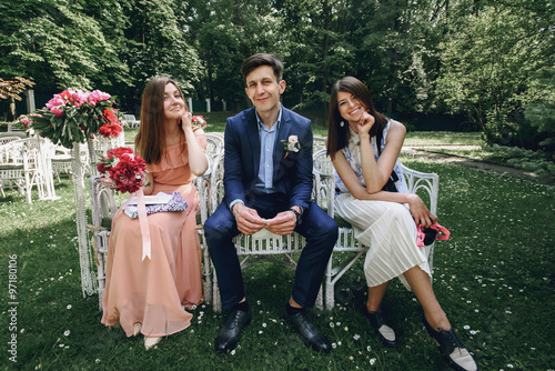 Wall Mural elegant stylish happy guests and bridesmaid waiting for a weddin