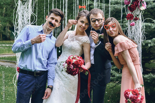 Fototapet elegant stylish happy guests and bride and groom having funny ph