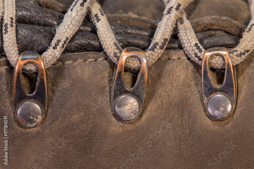 Detail of trekking shoes hook and loop for the strap.
