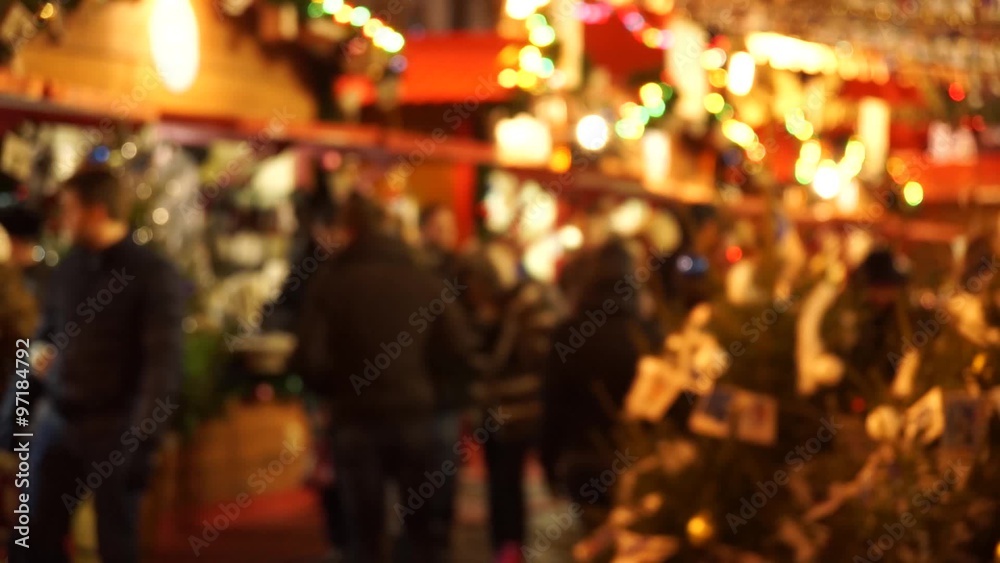 People visit Christmas Fair in old town at evening. Defocused People visit Christmas Fair in old town at evening. Defocused