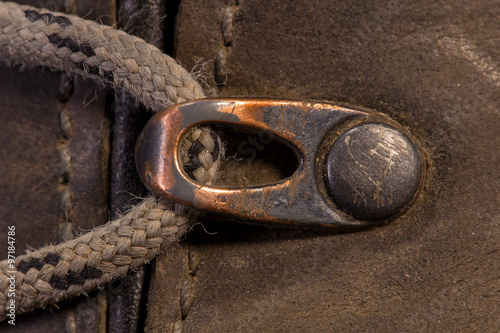Detail of trekking shoes hook and loop for the strap.
