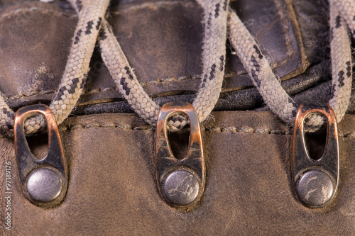 Detail of trekking shoes hook and loop for the strap.