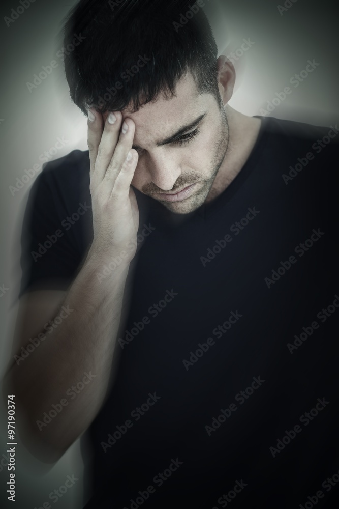 Man with headache holding his head with hand Man with headache holding his head with hand