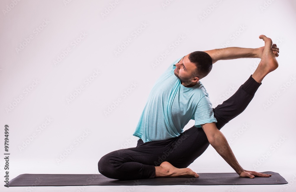 Man is making yoga isolated over white background Man is making yoga isolated over white background