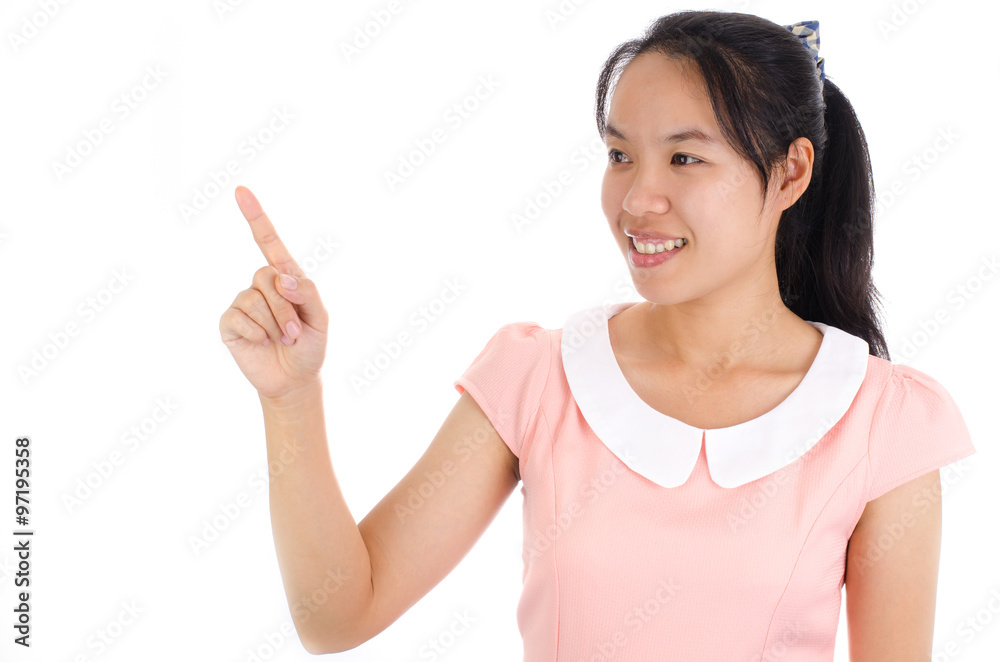 Portrait of young asian woman smile and point up or touch something on white background Portrait of young asian woman smile and point up or touch something on white background