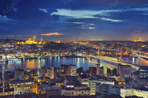 Istanbul. Image of Istanbul with Suleymaniye Mosque and Golden Horn Metro Bridge during twilight blue hour.