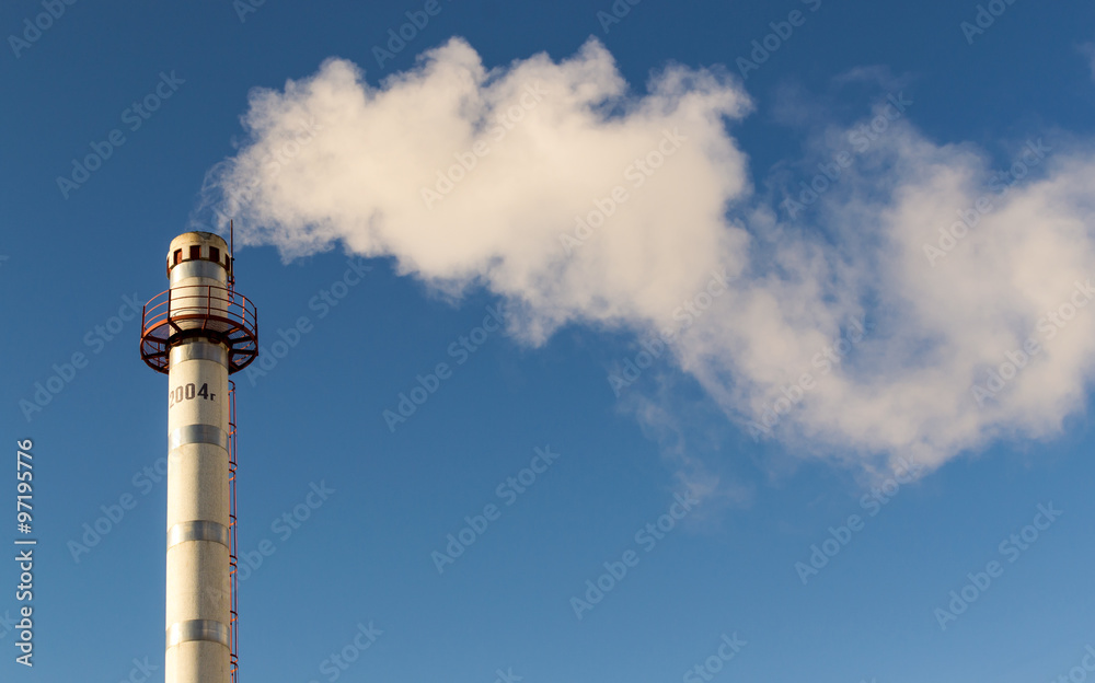 Chimney Pollution Smoke Rising into a Blue Sky Chimney Pollution Smoke Rising into a Blue Sky
