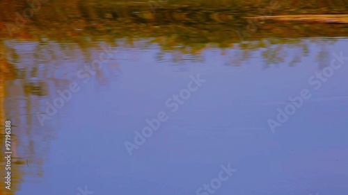 Water flowing at the waterfall, calm atmosphere, panning