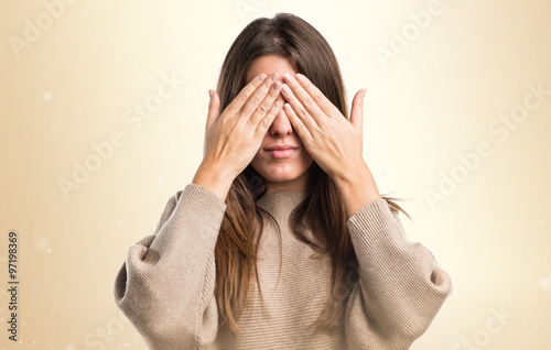 Girl covering her eyes