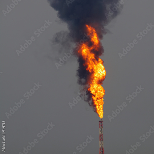 Blast of fire from oil refinery stack