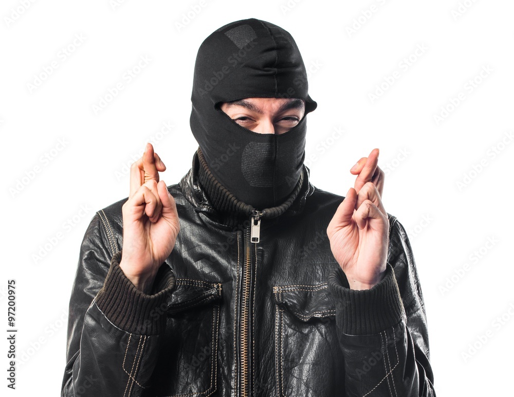 Robber with his fingers crossing Robber with his fingers crossing