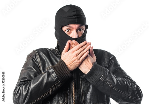Robber covering his mouth
