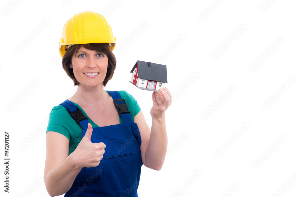 Nette Handwerkerin mit Modell-Haus und Daumen hoch Nette Handwerkerin mit Modell-Haus und Daumen hoch
