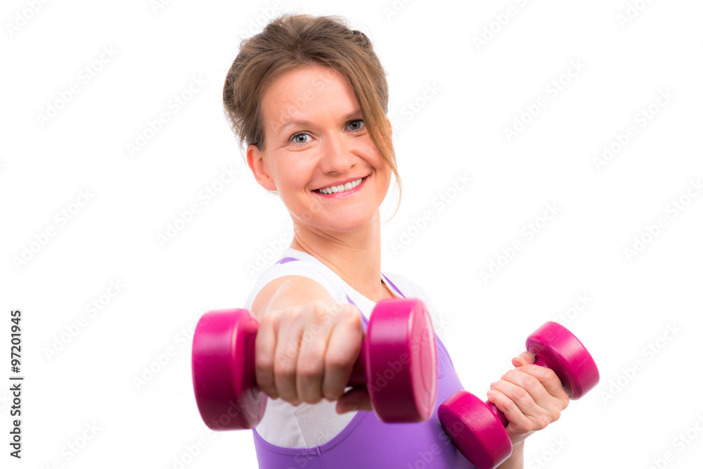 sportliche frau hält hanteln