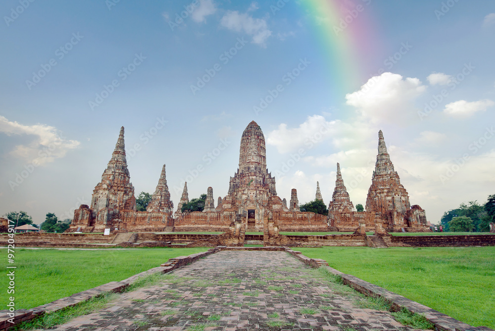 Fototapeta premium Old buddha pagoda temple with cloudy sky and rainbow in Ayuthaya Thailand