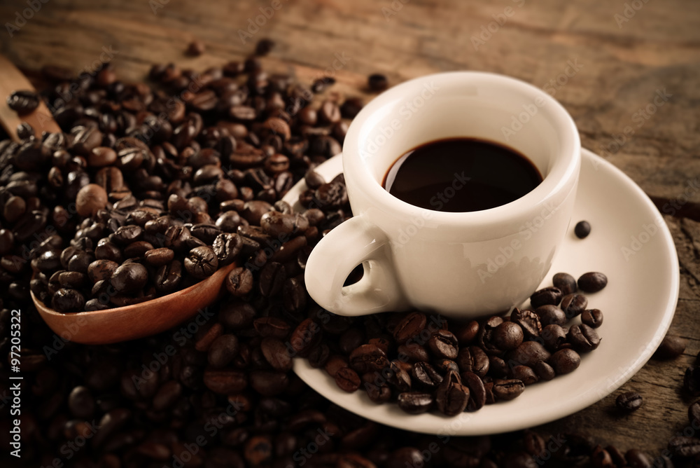 Fototapeta premium coffee cup and coffee beans - tilt shift effect photo 