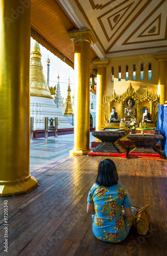 Myanmar, Yangon, religious in prayer in the Swedagon Pagoda.