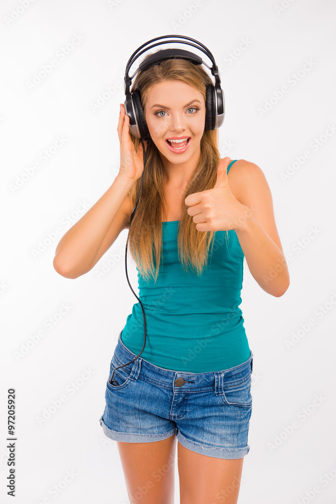 Sexy girl listening to music on headphones Stock Photo | Adobe Stock