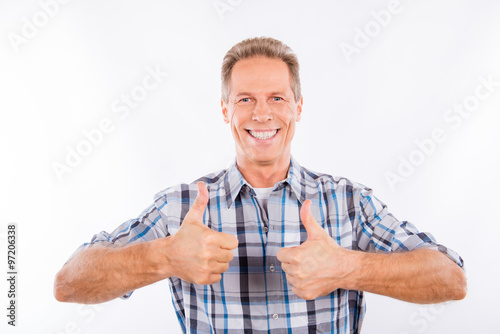 Confident happy aged man showing thumbs up