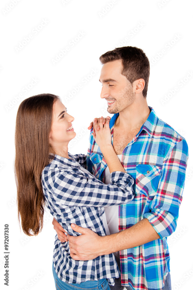 Cheerful cute couple in love embracing each other Cheerful cute couple in love embracing each other