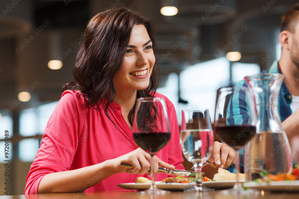 happy woman having dinner at restaurant happy woman having dinner at restaurant