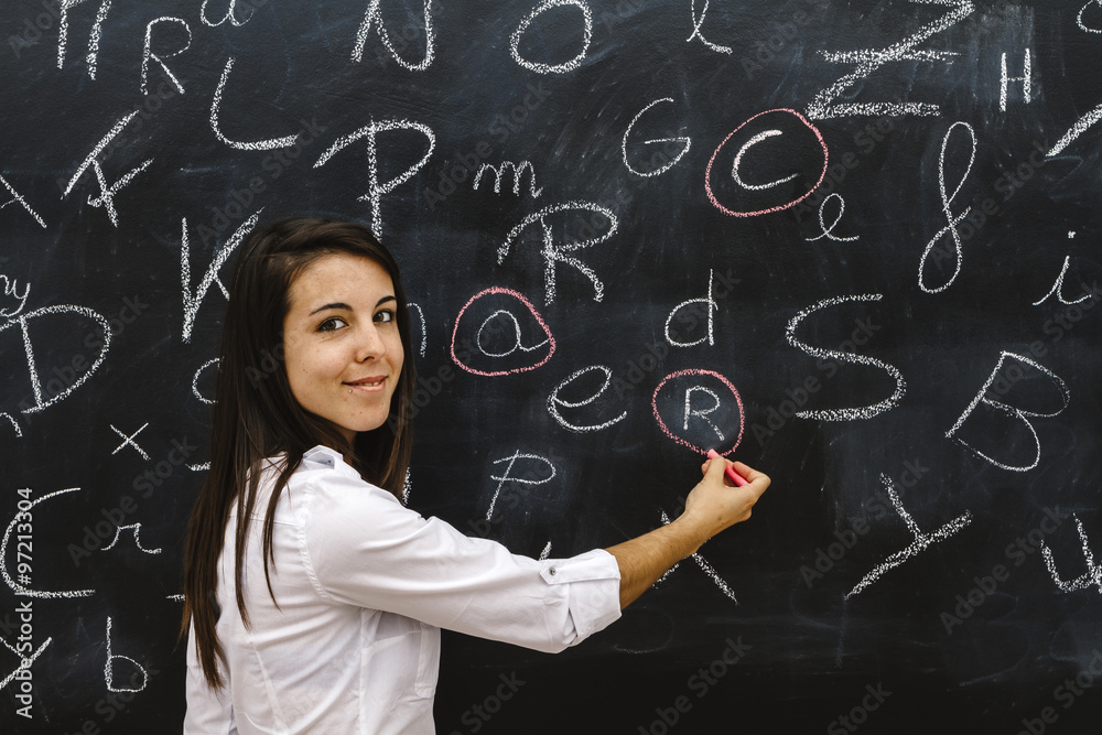 teacher in the classroom on blackboard background teacher in the classroom on blackboard background