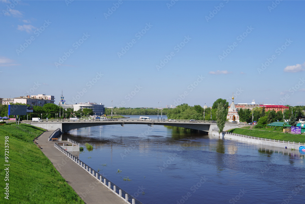 Summer views of river Om, Jubilee bridge and Seraphimo-Alekseevskaya chapel, Omsk, Russia
