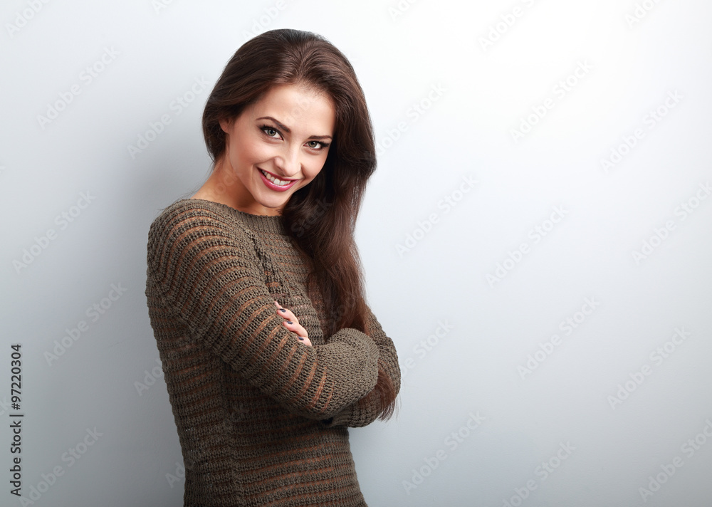 Beautiful happy brunette woman in warm sweater looking
