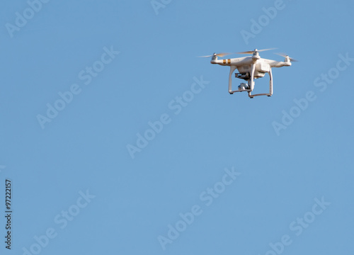 Drone in flight with a mounted camera