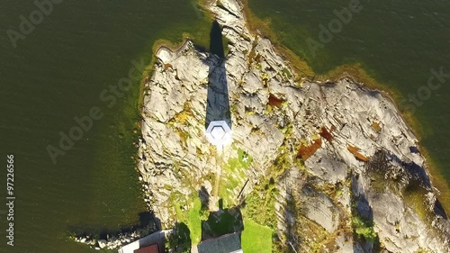 Aerial View, Descending Upon White Lighthouse on Rocky Point, Crystal-Clear Water
 photo