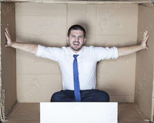 businessman fighting for more space in the office photo