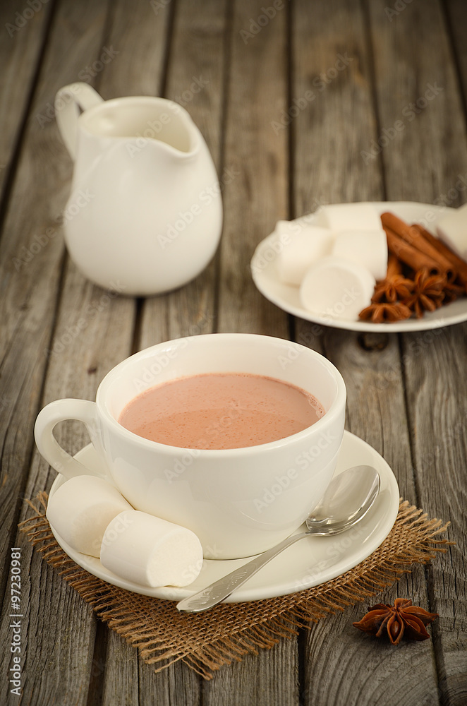 Hot chocolate with marshmallows on the rustic wooden table Hot chocolate with marshmallows on the rustic wooden table
