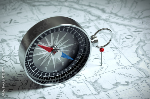Compass On The Map And Red Pin
