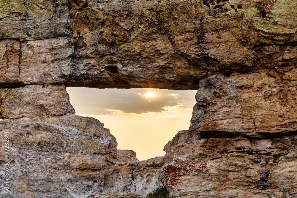 Sunlight rising on a rock window