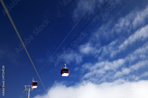 Gondola lifts at ski resort and blue sky with clouds in nice day