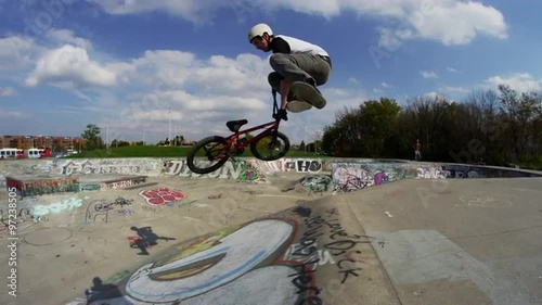 Extreme Sports Tail Whip on BMX Bike in slow motion photo