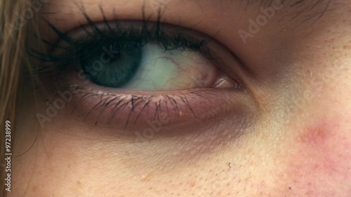 open female blue eye in 1080p a beautiful girl staring into the camera