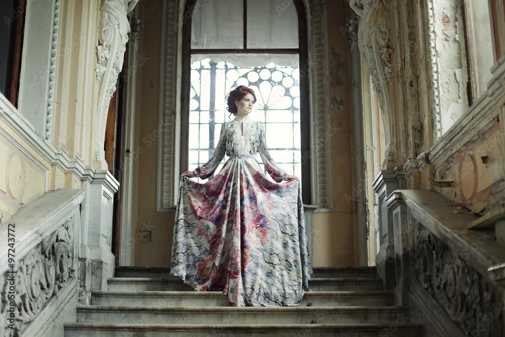 woman standing on the top of a stairway 