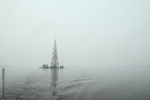 Famous and Beautiful Flooded Belltower on the River Volga on a rainy cloudy autumn day. Kalyazin, Russia