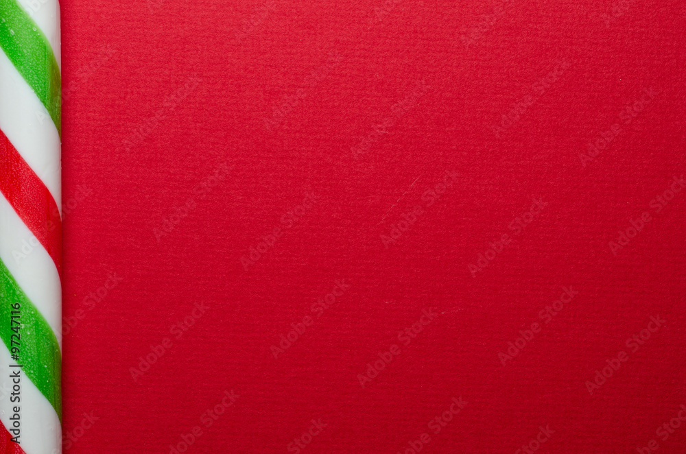 One candy cane at left of frame One candy cane at left of frame