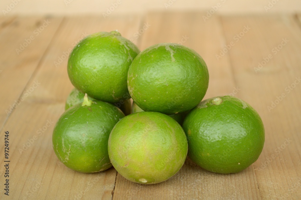 green lime on wood plank green lime on wood plank