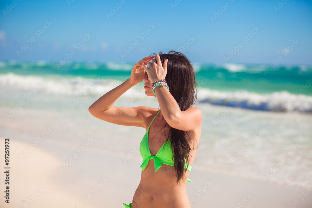 Young woman enjoy vacation on white tropical beach Young woman enjoy vacation on white tropical beach