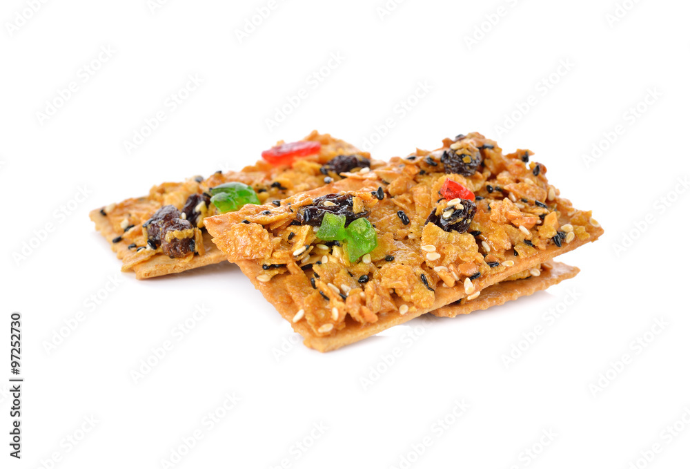 crispy cornflake pies with sesame and raisin on white background crispy cornflake pies with sesame and raisin on white background