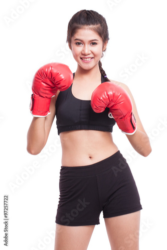 Boxer woman. Boxing fitness woman smiling happy wearing red boxing gloves on white background. © japhoto