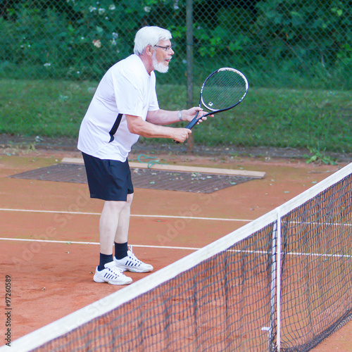 Senior man playing tennis © michaklootwijk