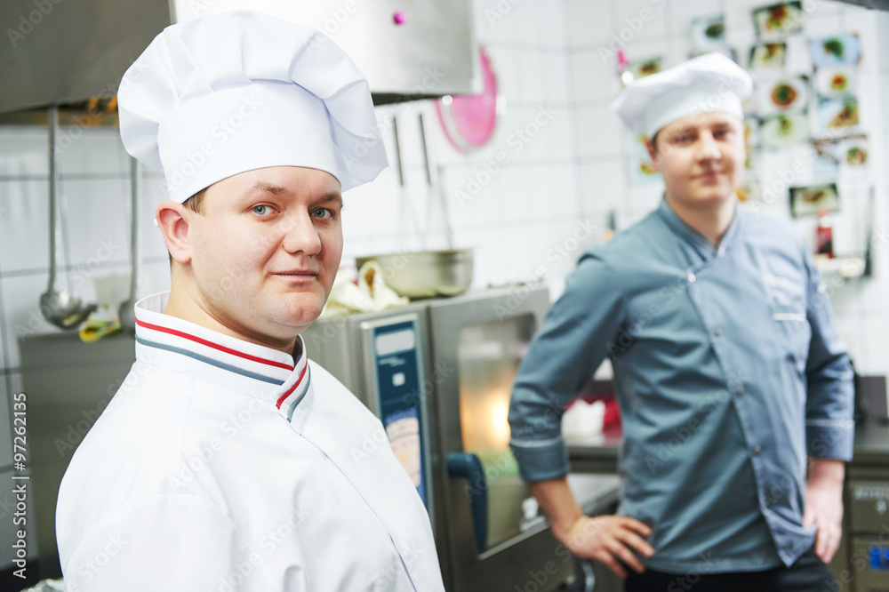 Two chef cook at kitchen