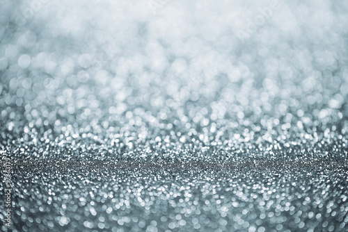 Christmas Background. Silver Holiday Glowing Glitter Bokeh